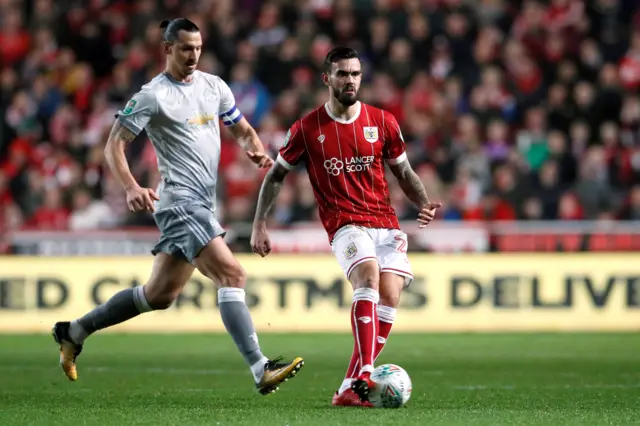 Bristol City's Marlon Pack in action with Manchester United's Zlatan Ibrahimovic