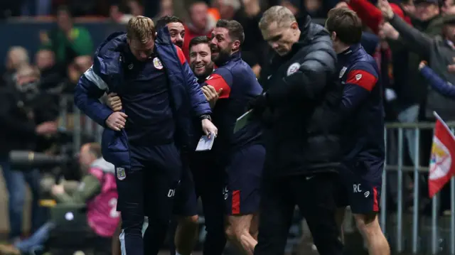 Lee Johnson and his coaching staff celebrate Joe Byran's goal