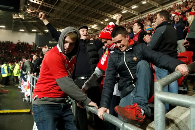 The Bristol City fans celebrate after the final whistle