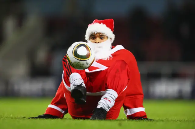 Santa Claus with football skills