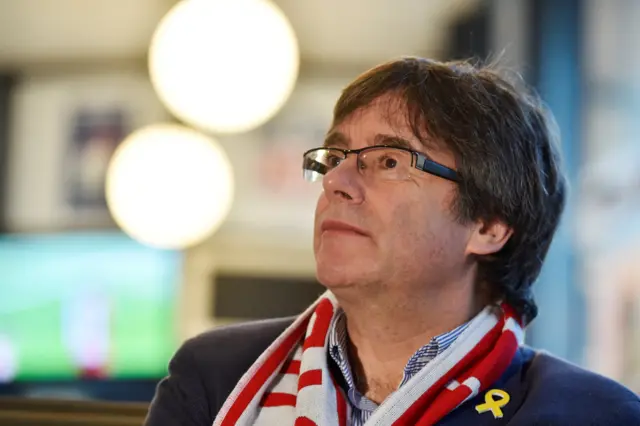 Former Catalan president Carles Puigdemont watches the Girona v Getafe Spanish La Liga soccer match in a bar in Brussels, Belgium, December 17, 2017