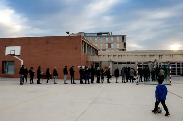 Voters queue to cast their ballots outside a polling station in Parets del Valles, Barcelona, Catalonia, Spain, 21 December 2017