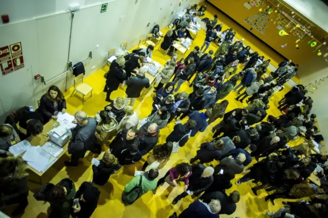 Voters wait to cast their ballots in a polling station in Barcelona, Catalonia, Spain, 21 December 2017.