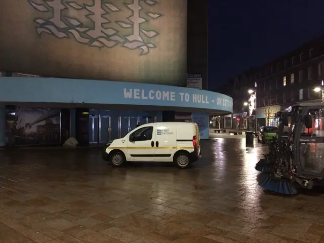 Council workers clearing area by former BHS building