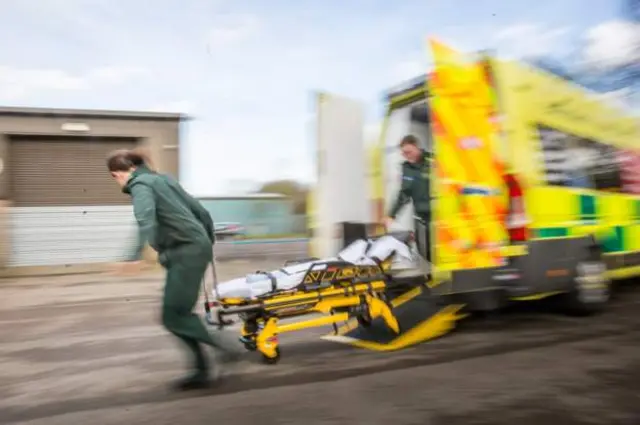 Paramedic with ambulance