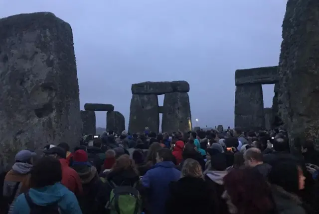 People wait at Stonehenge