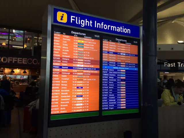 A flight information board at Bristol Airport