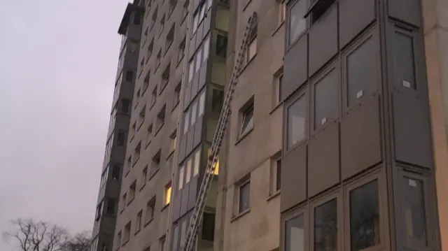 Ladder against tower block