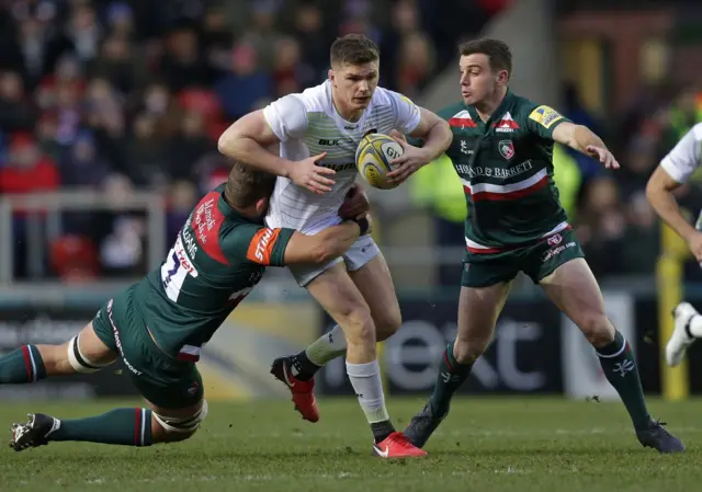 Saracens' Owen Farrell is tackled