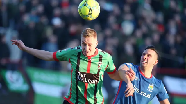 Glentoran's Callum Birney in action against Linfield's Andrew Waterworth