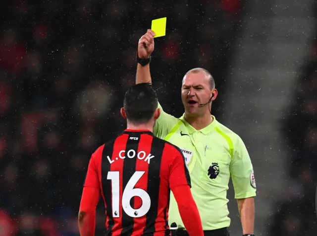 Lewis Cook of AFC Bournemouth is shown a yellow card