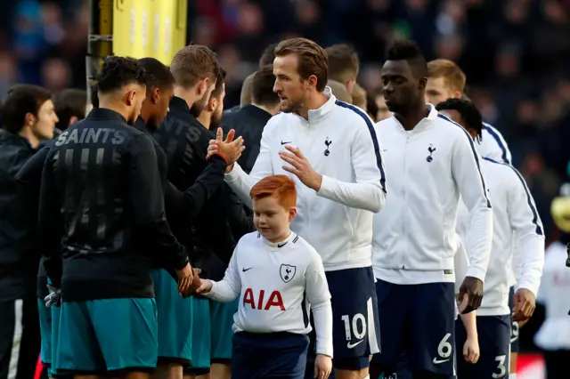 The two teams shake hands