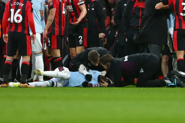 Cheikhou Kouyate of West Ham United receives treatment