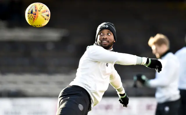 Celtic's Moussa Dembele warms up at Dens Park