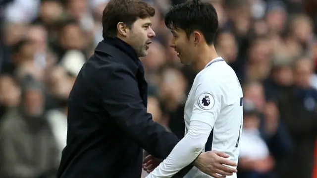 Son Heung-min is hugged by Mauricio Pochettino