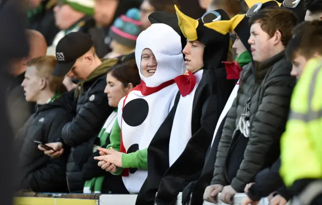 Celtic fans in fancy dress enjoy their day at Dens Park