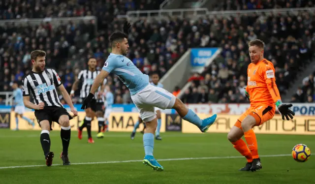 Sergio Aguero sees his shot hit the post