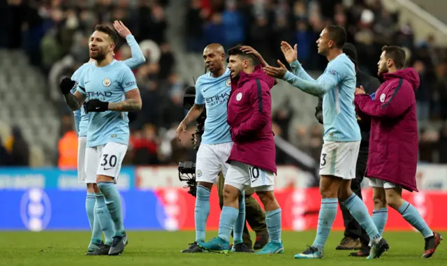 Man City's players celebrate at full-time