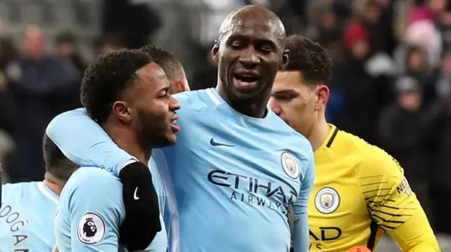 Eliaquim Mangala hugs Raheem Sterling at full-time