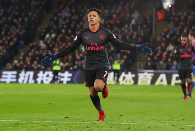 Alexis Sanchez celebrates scoring against Crystal Palace.