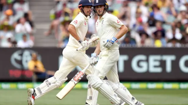 Alastair Cook (L) and Chris Woakes (R) take more runs from the Australian bowling on the third day