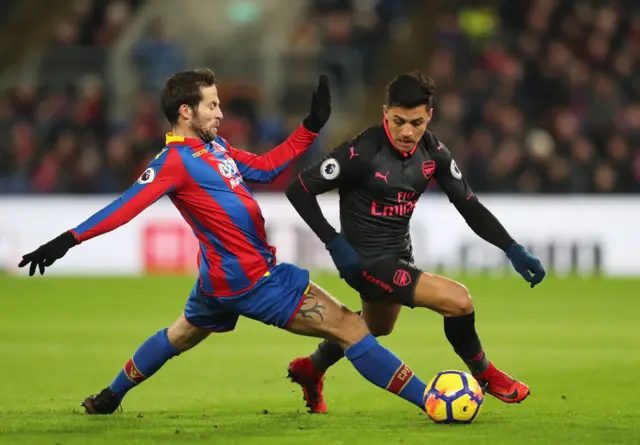 Alexis Sanchez of Arsenal evades Yohan Cabaye of Crystal Palace