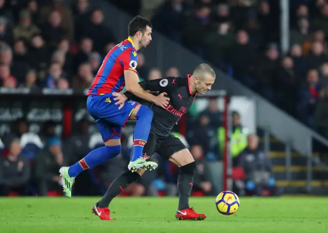 Jack Wilshere holds off Luka Milivojevic