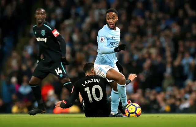 Raheem Sterling dribbles past Manuel Lanzini