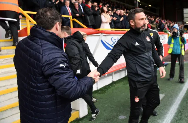 Derek McInnes shakes hands with Graeme Murty