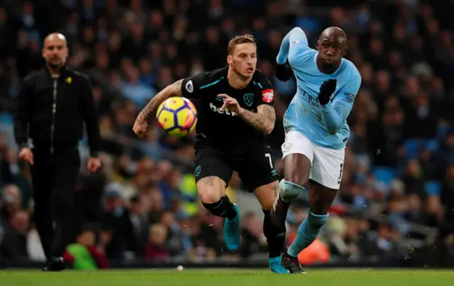 Marko Arnautovic runs past Eliaquim Mangala