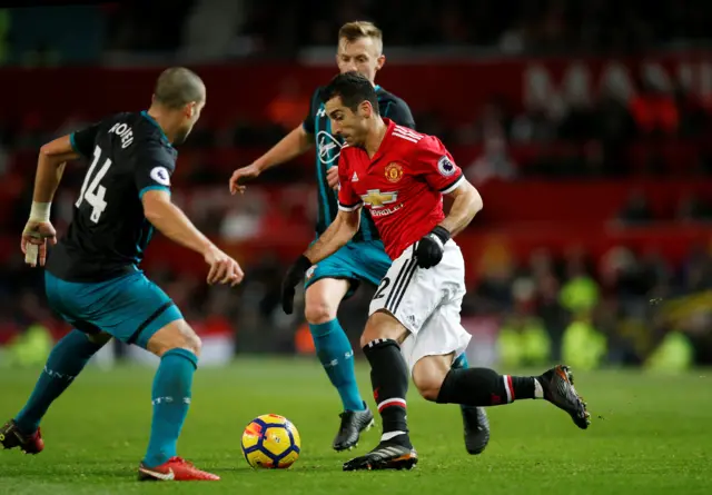 Henrikh Mkhitaryan runs with possession