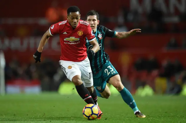 Anthony Martial runs with possession