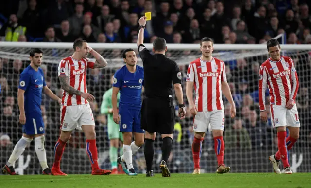 Pedro is shown a yellow card