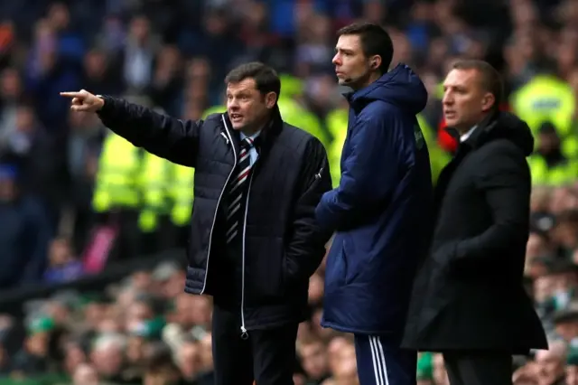 Graeme Murty makes a point to his Rangers side as Brendan Rodgers looks on