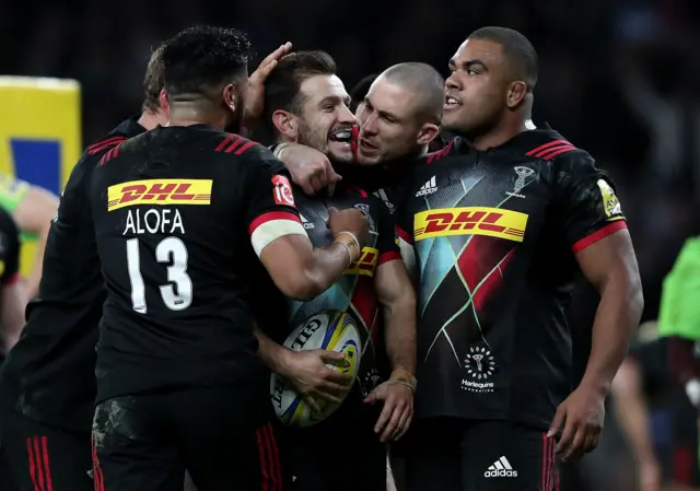 Danny Care celebrates one his tries with Harlequins team-mates