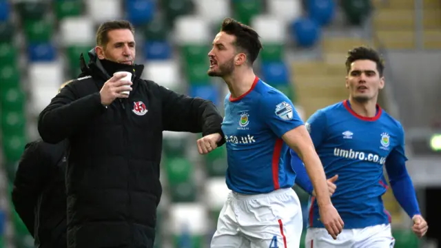 Crusaders boss Stephen Baxter with Linfield goalscorer Josh Robinson