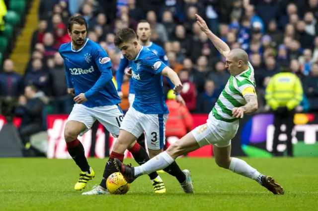 Celtic's Scott Brown tackles Rangers' Declan John