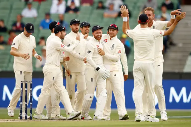 Stuart Broad celebrates with teammates