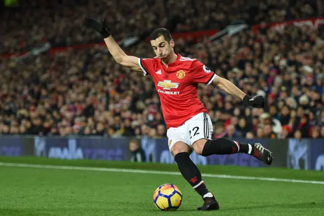 Henrikh Mkhitaryan prepares to cross the ball