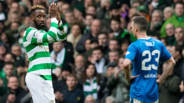 Moussa Dembele applauds the Celtic fans as he leaves the pitch after being substituted