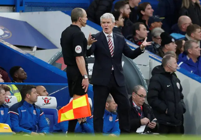 Mark Hughes remonstrates with the fourth official