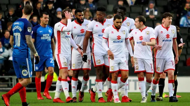 MK Dons celebrate Chuks Aneke's goal against Peterborough