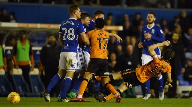 Diogo Jota is pushed by Harlee Dean