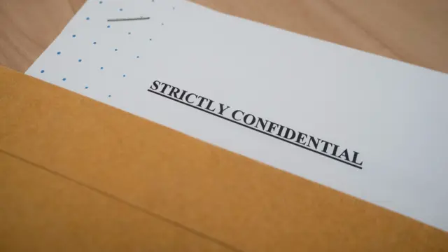 A document that reads: Strictly confidential