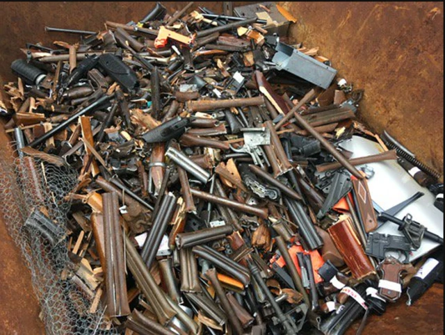 pile of firearms