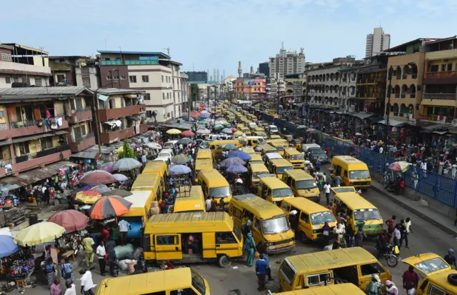 - Public transport minibuses painted in bright yellow colour popularly called 'Danfo' barricade the roads in search of passengers and causing traffic gridlock at Idumota in Lagos on May 10, 2017