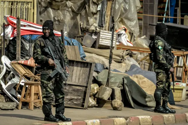 Soldiers from the Rapid Intervention Battalion (BIR) secure a ceremony honouring four killed in the violence in Cameroon