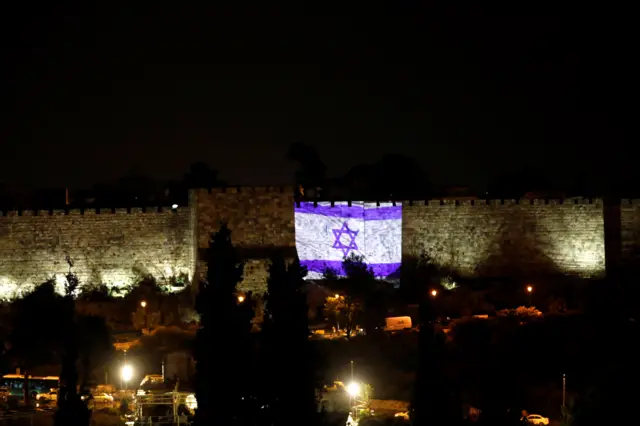 Israeli flag is projected on a part of the walls surrounding Jerusalem's Old City