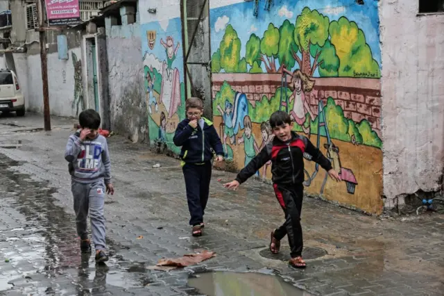 Palestinians on the streets of the Rafah refugee camp in Gaza.