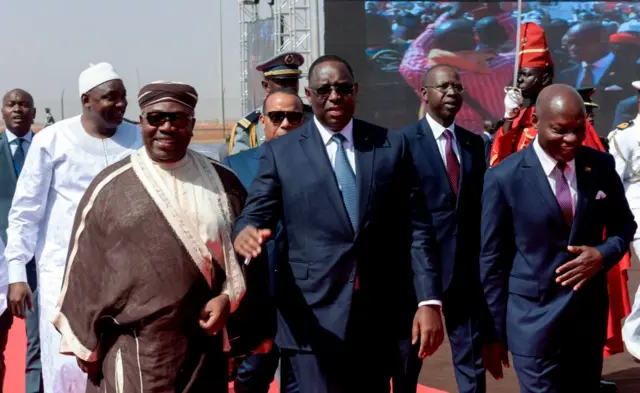 Senegal's President Macky Sall (centre) arrives alongside Gabon's President Ali Bongo (left), Gambia's President Adama Barrow (far-left) and Guinea-Bissau's President Jose Mario Vaz (right)